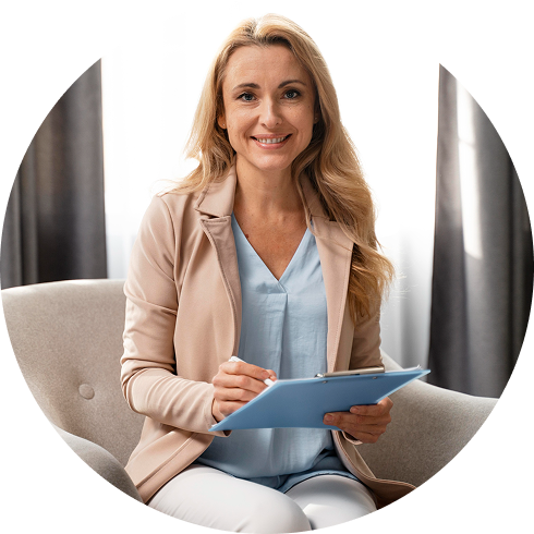 Smiling woman therapist holding clipboard during counseling session