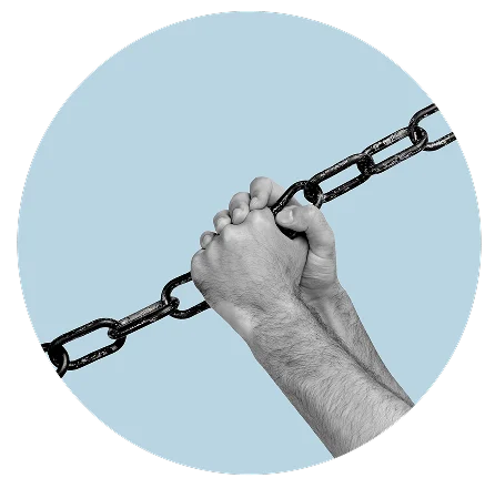 Hands gripping a metal chain against a light blue circular background
