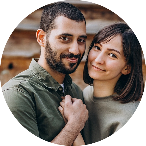 Happy couple standing close together and smiling outdoors