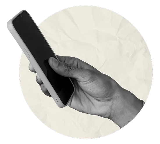 Hand holding a smartphone against a textured beige circle background